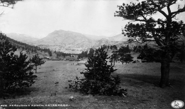 View of the Horace Ferguson Ranch in Estes Park, Larimer County, Colorado. Shows a ranch house, cabins and a barn.