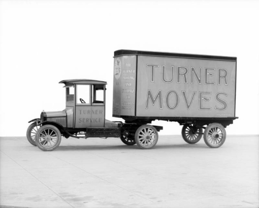 View of a truck and trailer in Denver, Colorado; lettering reads: "Turner Moves - The Turner Moving and Storage Co."