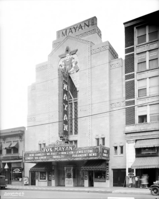 View of the Mayan Theater at 110 Broadway in the Speer neighborhood of Denver, Colorado. The four-story building has an ornate theater facade and a marquee that reads: "Bebe Daniels, 'My Past' and Ben Lyon Lewis Stone Comedy 'His Error' 'Novelty' Paramount News."