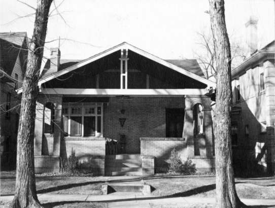 View of a house at 1311 Steele Street in the Congress Park neighborhood of Denver, Colorado; features a porch with arch ornaments.