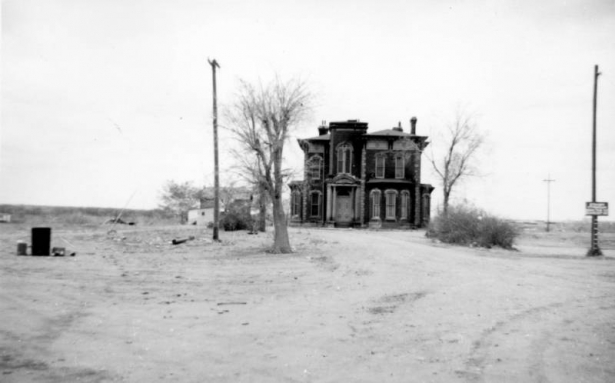 View of the John B. Hindry home at 5500 North Washington Street in Denver, Colorado; shows a house with quoins and a bay window.
