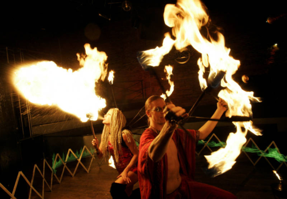 (Denver, Colorado, 11/15/2005) Weekend Spotlight:   Firemancer is a fire-dancing troupe slated to perform in this year's Parade of Lights. The two-person group, comprised of Doug Bates (cq) and Melinda Rivers (cq), demonstrated their skills at Club Sky...