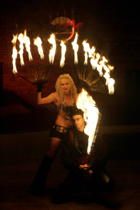 (Denver, Colorado, 11/15/2005) Weekend Spotlight:   Firemancer is a fire-dancing troupe slated to perform in this year's Parade of Lights. The two-person group, comprised of Doug Bates (cq) and Melinda Rivers (cq), demonstrated their skills at Club Sky...