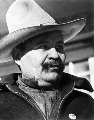 Portrait of a Mexican migrant worker in Colorado. He wears a wide-brimmed hat and jacket with a pin that reads: "CIO."