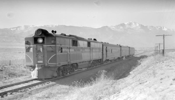 Train #8, Rocky Mountain Rocket; 3 cars, 35 MPH, shows Pikes Peak. Photographed: east of Colorado Springs, Colo., January 10, 1943.