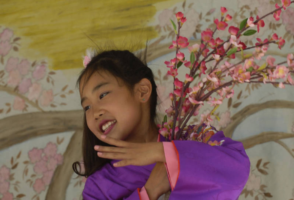 Michelle Akiyana, eleven years old, dances with members of the Denver Buddhist Temple Dancers Sunday afternoon June 19, 2005 as part of the Cherry Blossom Festival being held in Denver. The festival was formed in 1989 to promote Japanese dance and cult...