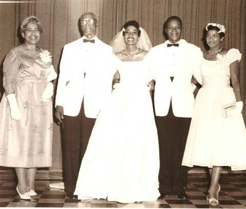 Photograph of the wedding of Faye Henry and Sergeant Ennis Hudson Jr. in Houston, Texas.  Included in the picture from left to right are: Mrs. Lillian Jones Henry, Mr. Vern C. Henry, Faye and Ennis Hudson Jr., Mrs Orvee Jones Taylor, mother of Ennis Hudson from St. Louis, Missouri.