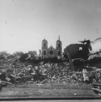 View of St. Cajetan's Catholic Church (now St. Cajetan's Center), 1190 9th (Ninth) Street in the Auraria neighborhood, Denver, Colorado.  The church is surrounded by rubble, the remains of buildings destroyed for the Auraria Higher Education Center campus.