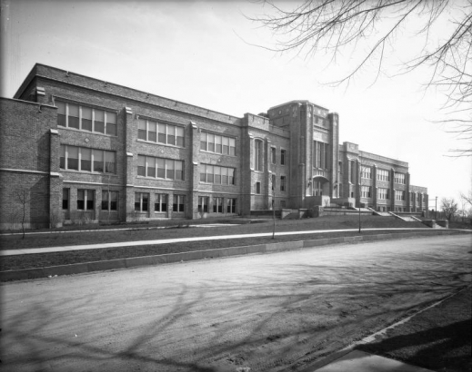 View of Byers Junior High School on Bayaud and South Pearl Streets in the Speer neighborhood of Denver, Colorado; features brick with stone and ceramic tile trim.