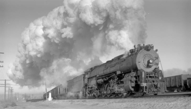 Train First #24, Grand Canyon Limited; 8 cars, 40 MPH; fine smoke effect. Photographed:  leaving Belen, N.M., January 12, 1947.
