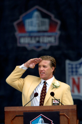 (CANTON, Ohio., SHOT 8/8/2004) As a final tribute to all the Broncos' fans, John Elway performs one final Mile High Salute Sunday at the end of his Pro Football Hall of Fame Induction speech. John Elway and the three other inductees into the Pro Footba...