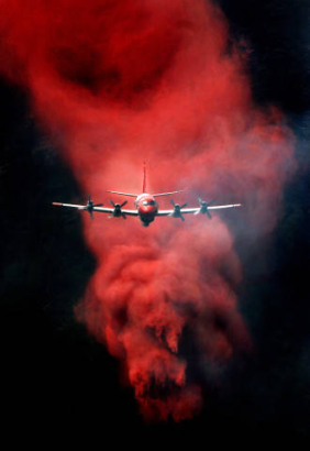 A P3 Orion bomber drops a load of fire retardant on the Big Elk Fire near Estes Park, Colorado.