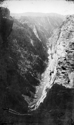 Bird's eye view of the Black Canyon of the Gunnison (Gunnison or Montrose County), Colorado. Shows Denver & Rio Grande Railroad tracks, a railroad bridge, and the Gunnison River.