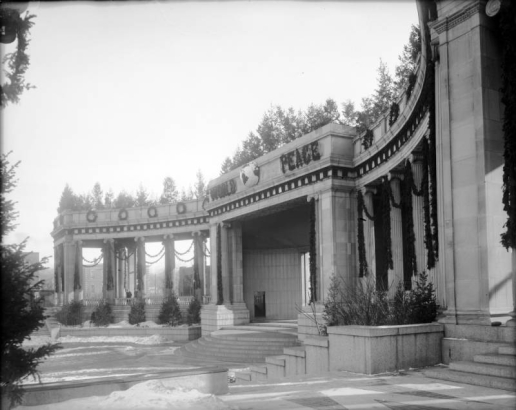 View of the Greek Theater and Colonnade of Civic Benefactors at Civic Center park in Denver, Colorado. Christmas decorations and letters flank a globe and read: "World Peace."