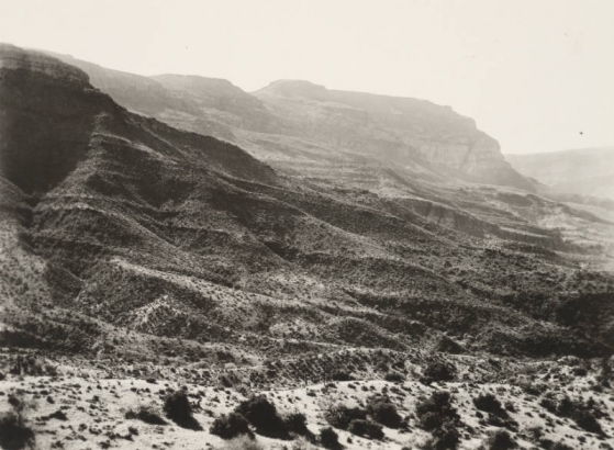View of brush and cactus-covered ridges and buttes in probably the Superstition Mountains in the Salt River Valley in Arizona.