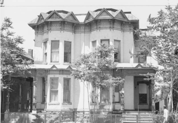 View of 2613-2619 California Street in the Five Points neighborhood (Curtis Park) of Denver, Colorado. Constructed in 1887, the two-story Italianate duplex has a rusticated stone foundation, brick walls, and a mansard roof with elaborate bracketed wooden jig-sawn friezes and cornices, topped with pediment shaped windows. Both duplexes have bays and porches.The building is listed on the National Register of Historic Places as a contributing resource to the Curtis Park-Champa Street Historic District.