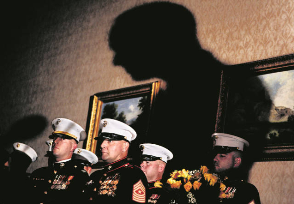 Marines prepare to deliver posthumous medals to families.