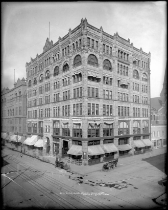 Exterior view Kittredge Building, 16th (Sixteenth) and Glenarm Streets, Denver, Colorado; constructed in 1890-1891; street level businesses include Franco-American Food Company, Columbia Phonograph Company, and Knight-Locke Piano Company; Dentist Robert Kettner on second floor; Mountain Electric Company building on Glenarm adjacent right; shows bicycles, horsedrawn wagon and carriage parked at curb, and street railway car tracks.