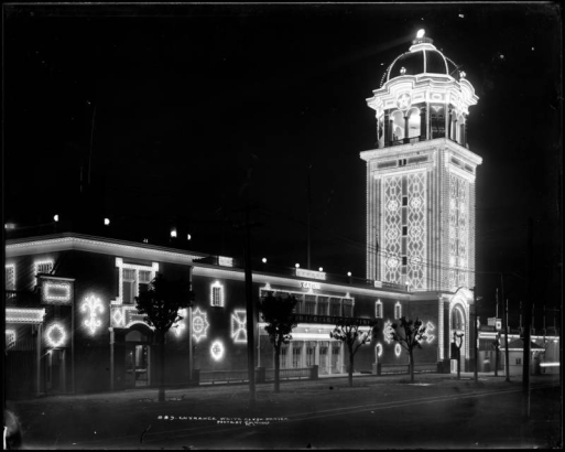 Main entrance to "White City" at night (later called Lakeside Amusement Park), Lakeside, Colorado near Denver; night time view of illuminated Casino and Tower; summer evening.