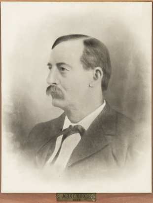 Studio portrait of John C. Moore, Mayor of Denver, Colorado, from 1859 to 1861.  He has a mustache, and wears a coat and tie.