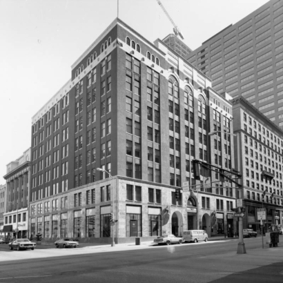 View of the Women's Bank building at 821 17th (Seventeenth) Street in downtown Denver, Colorado; the brick structure has stone trim, arched windows and doors.