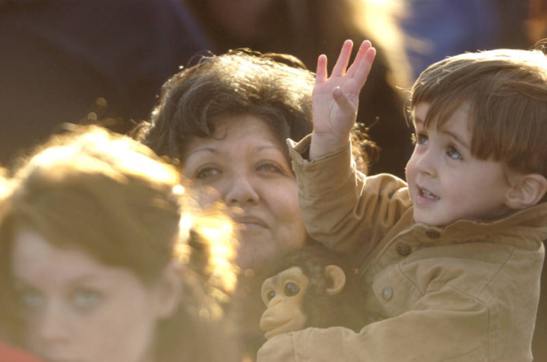 04/20/2004 Littleton, Colo.-A child waves to the sky as  doves, representing those killed in the Columbine shootings, fly away near the end of a ceremony marking the fifth anniversary of the Columbine shootings Tuesday, April 20, at Clement Park in Lit...