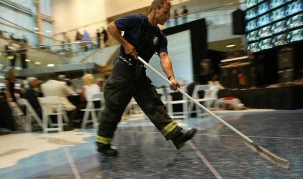 "Casino Magnifique," a benefit for Food Bank of the Rockies, at the Cable Center in Denver, Colo., on Friday, May 28, 2004.  An unidentified Denver Fire Department firefighter helps with clearing water from the tile floor inside the Cable Center after ...