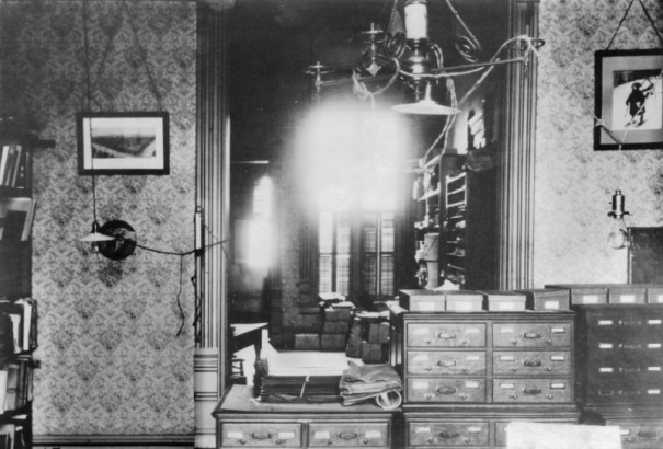Interior view of the cataloging room at Denver Public Library (La Veta Place) in Denver, Colorado; shows card catalog and hanging lights.