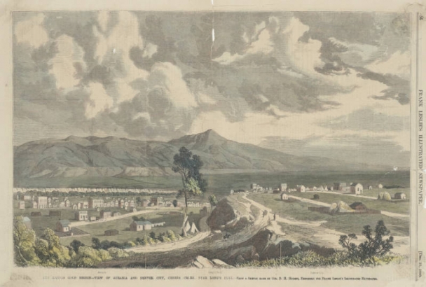 View of commercial buildings, houses and farms in Denver, Colorado. Shows a cluster of buildings in Auraria, sparse buildings and tepees on a bluff in Denver, trees along Cherry Creek and mesas, mountains and the summit of Longs Peak in the distance.