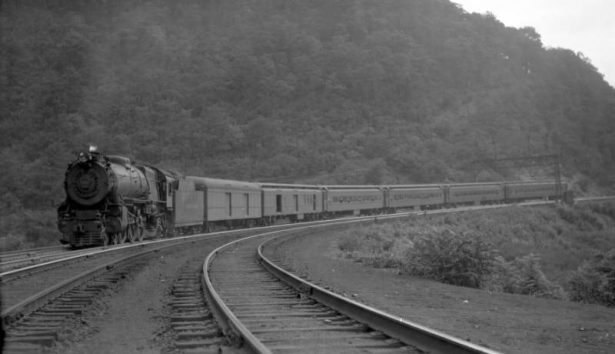 Passenger train on Horse Shoe curve; 6 cars, 10 MPH.               Photographed: near Altoona, Pa., August 19, 1933.