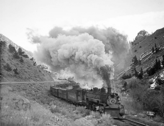 Denver and Rio Grande Western Railway Company (D&RGW) narrow gauge freight between Poncha Springs & Mears Jct. CO, engines 497, 491 & 494, 50 cars, 15 MPH
