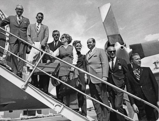 Members of the Denver Olympic Committee left for Amsterdam Monday to make Denver's showdown pitch for the 1976 Winter Olympic Games. Those who boarded King Resources plane at Stapleton were, left to right, Richard Davis, Gerald F. Groswold, Thomas Hildt, Jr., Mrs. Sidney Robbins, Brigitte Bastian, Norman Brown, Willy Schaefler and Bill Kostka, Jr. Plane left at 4 p.m.