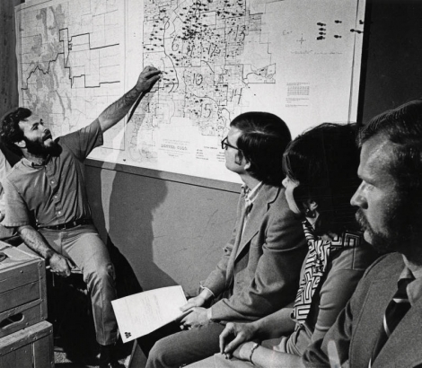 Dwight Filley, one of three state coordinators of Citizens for Colorado's future, discusses strategy Tuesday for a saturation campaign to urge Denver area voters to support two Nov. 7 ballot proposals aimed at thwarting future city and state funding of the 1976 Winter Olympics.