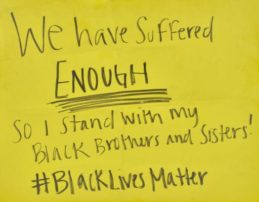 Poster gathered near Civic Center Park in Denver after a protest that took place in the aftermath of the George Floyd murder. The text reads "We have suffered enough. So I stand with my black brothers and sisters! #blacklivesmatter."