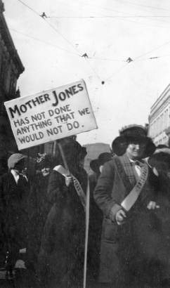 Women wear sashes that read: "Trinidad". One woman holds a sign that reads: "Mother Jones Has Not Done Anything That We Would Not Do".