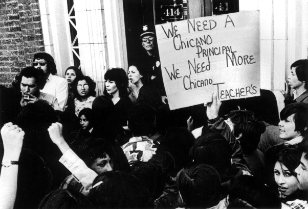 Mexican American protesters in Denver, Colorado hold a picket sign that reads: &quot;We need A Chicano Principal, We Need More Chicano Teachers.&quot;