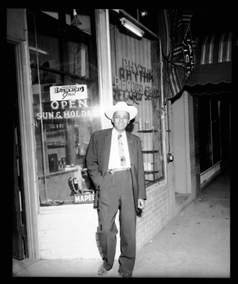 Leroy Smith in front of his Rhythm Records and Sporting Goods Store