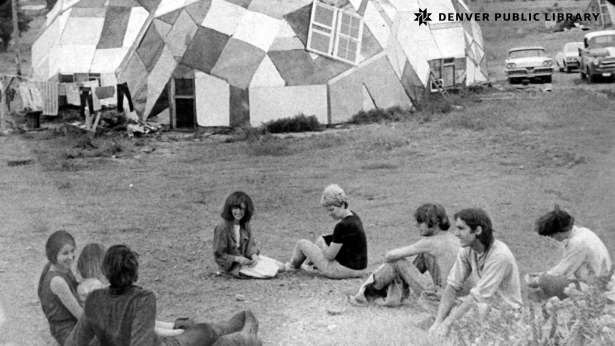 Droppers enjoy quiet moment of relaxation on hillside & just outside a window of a geodesic dome home
