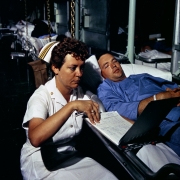 Navy Lieutenant Commander Dorothy Ryan checks a patient’s medical chart aboard the hospital ship USS Repose, off South Vietnam