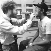 Dr. David Cohn examines patient Ron for AIDS symptoms 1985