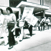 Protesters march against round-up of migrant workers 1982