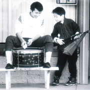 Coung Kong and Tony Vo practice drumming before Chinese New Year celebration 1992