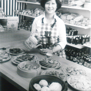 Molly Ng of Molly's Oriental Shop poses with Chinese cookery. 1980