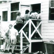 People tour Maria Rojas' kitchen on the Tanaka Farm near Longmont 1985 