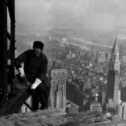 Workman on the framework of the Empire State Building, New York City