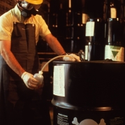 Pesticides inspector draws a sample of a toxic liquid, Greenville, Mississippi