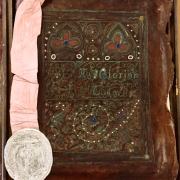 Ornamented cover and cloth bookmark, nestled in box