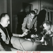 "Morey Bernstein, center, hypnotizes Ruth Simmons, a Colorado housewife, and tape records her memories of a previous lifetime as Bridey Murphy, 