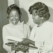Two women photographed at an awards ceremony including Erma Ford who was a member of the Delta Sigma Theta Sorority.