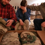 Jo Burns cries as she and her husband Bob opened the boxes containing their son's uniforms.
